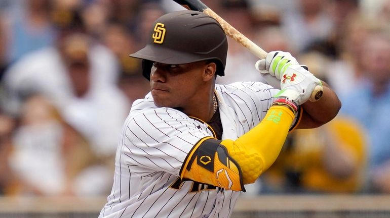 The Padres' Juan Soto bats during the first inning of...