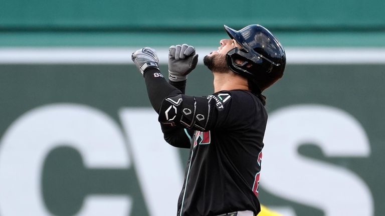 Arizona Diamondbacks' Eugenio Suárez reacts after hitting a two-run double...