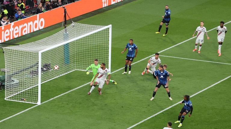 Atalanta's Ademola Lookman, bottom right, scores the opening of his...