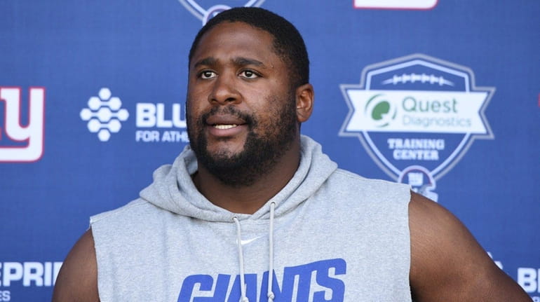 New York Giants offensive tackle Marshall Newhouse answers questions from...