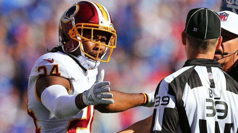 Josh Norman #24 of the Washington Redskins argues after having...