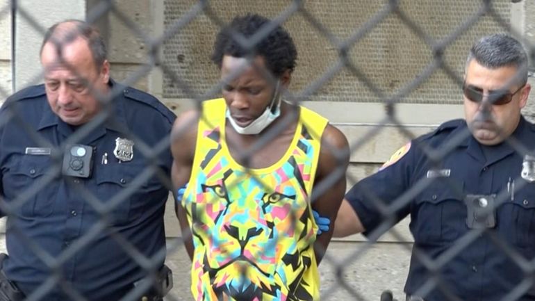 Curtis Desir, 28, of Brooklyn, leaves Nassau County Police headquarters in...