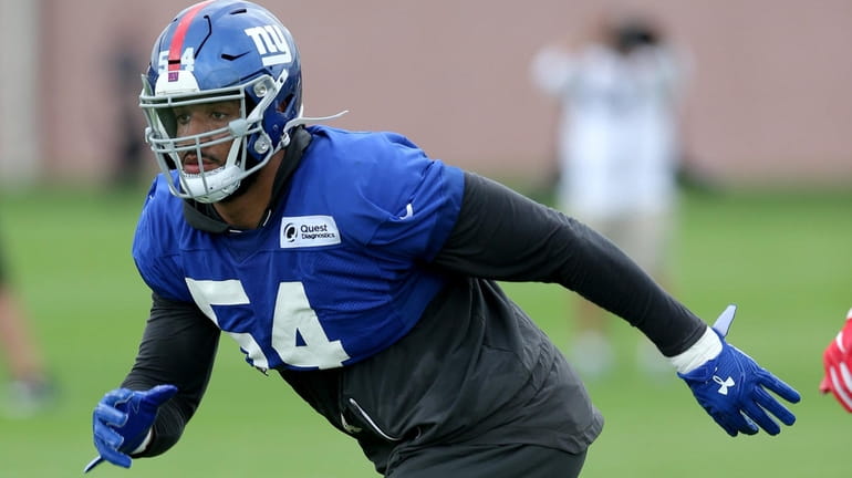 Giants linebacker Olivier Vernon drops into coverage during training camp...
