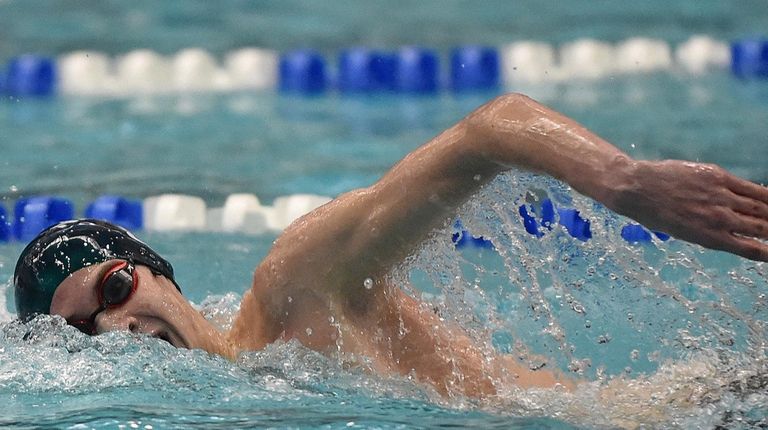 Jake Newmark of Garden City competes in the 200-yard freestyle...