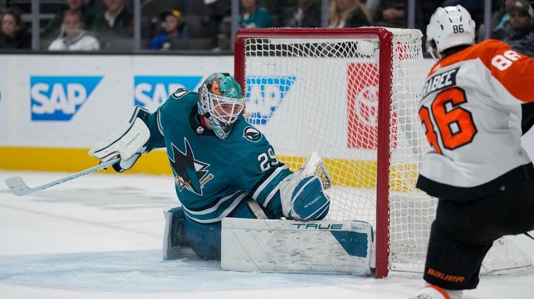 San Jose Sharks goaltender Mackenzie Blackwood (29) is unable to...