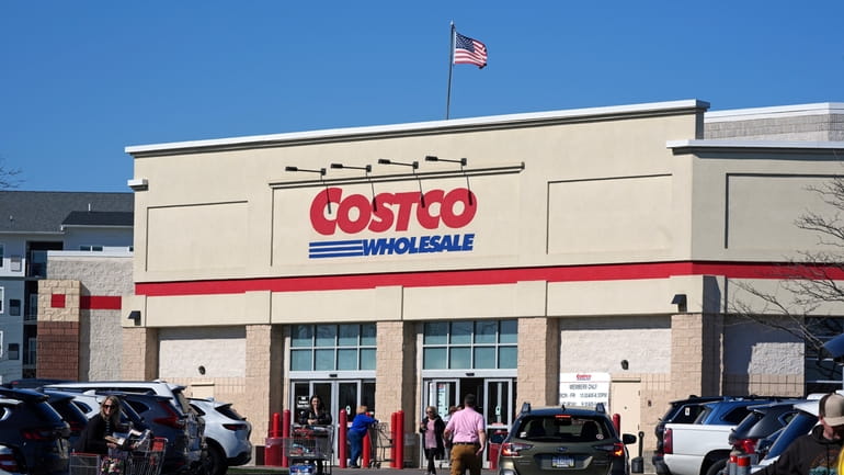 People enter Costco Warehouse in Cranberry Township, Pa., Friday, March...