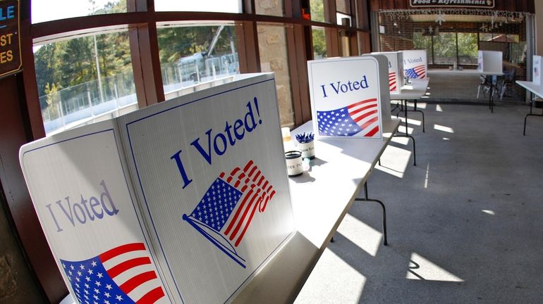 An early election ballot completion area is prepared at a...