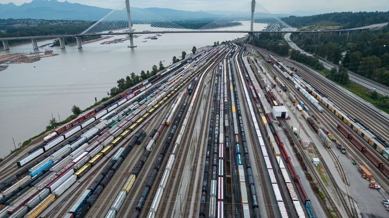 Train cars are seen on the tracks in an aerial...