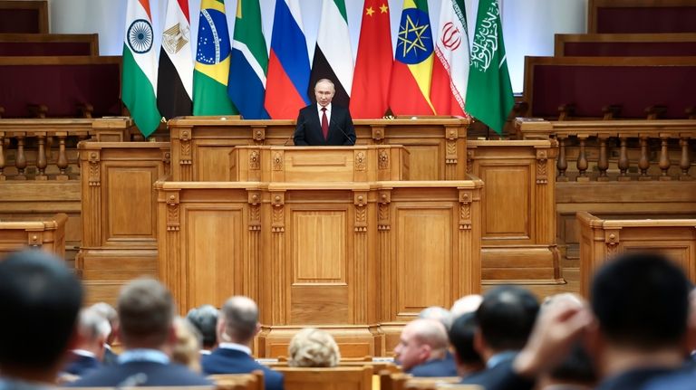 Russian President Vladimir Putin addresses the BRICS Parliamentary Forum in...