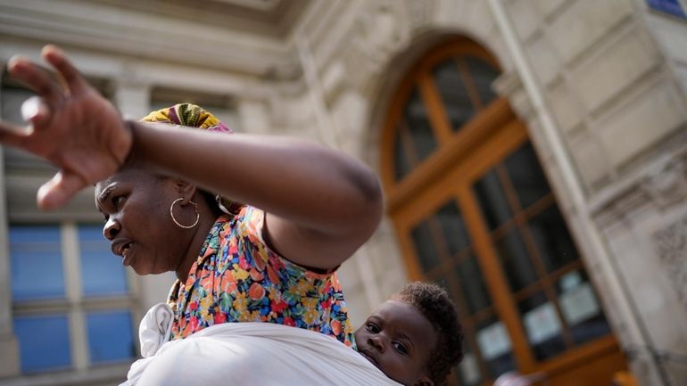 Natasha Louise Gbetie, from Burkina Faso, and her son Richard...