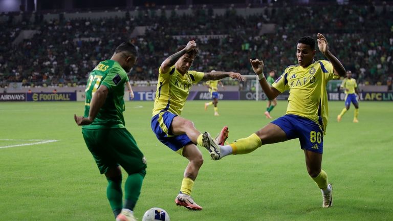 Shorta's Iraqi player Ameer Sabah, left, fights for the ball...