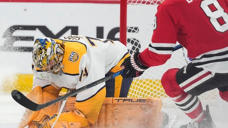 Nashville Predators goaltender Juuse Saros makes a save against Chicago...