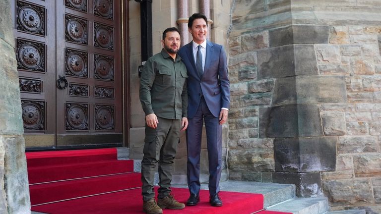 Prime Minister Justin Trudeau poses with Ukrainian President Volodymyr Zelenskyy...