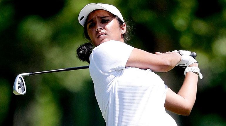 Syosset's Malini Rudra hits her tee shot on the 12th...