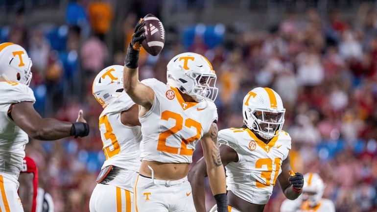 Tennessee linebacker Jeremiah Telander (22) celebrates a fumble recovery against...