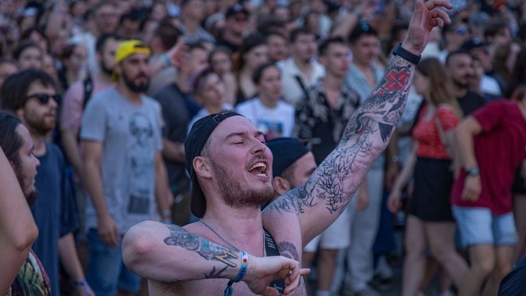 People enjoy a concert at the Atlas Festival in Kyiv,...