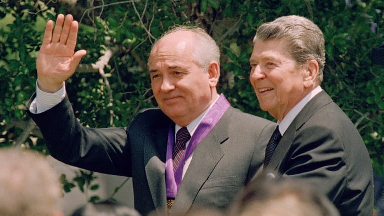 Former President Ronald Reagan, right, with then-Soviet President Mikhail Gorbachev in...