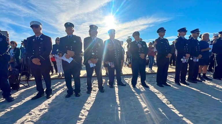 Firefighters mark the 23rd anniversary of the 9/11 attacks with...