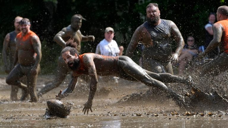 Andre Rioux, of Nashua, N.H., dives for the ball in...