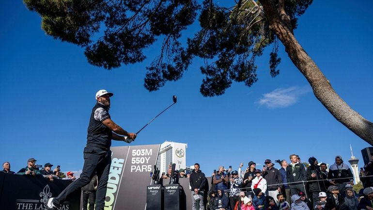 Captain Dustin Johnson, of 4Aces GC, watches his shot from...