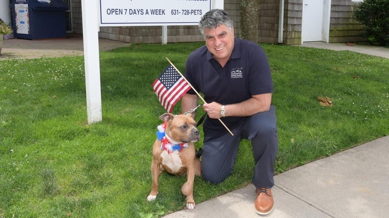 Southampton Animal Shelter Foundation Executive Director Anthony Sabia with Foxy, gussied...
