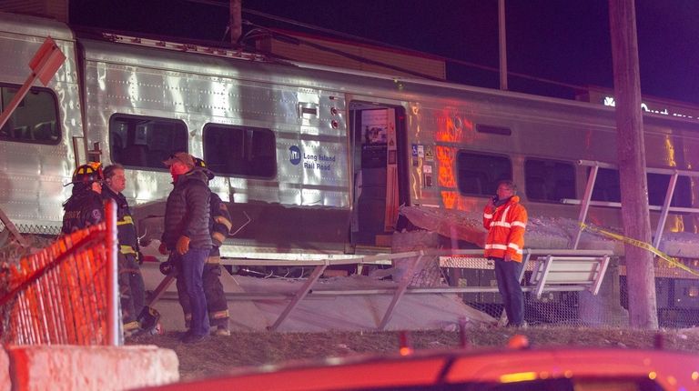 Emergency crews work on a LIRR derailment at the Westbury...