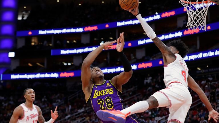 Los Angeles Lakers forward Rui Hachimura (28) has his shot...