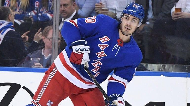 Rangers left wing Chris Kreider skates during a game against...