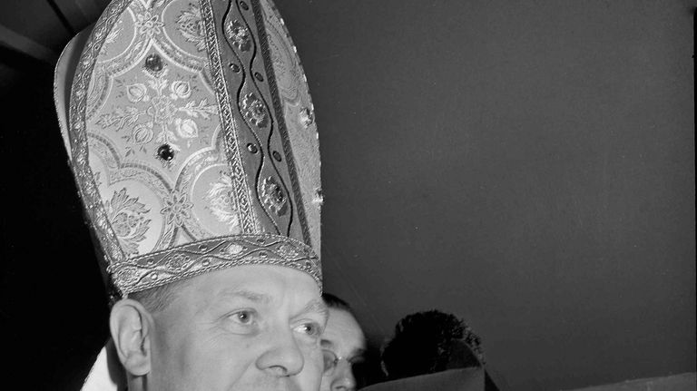 Then Rev. Christopher J. Weldon, Bishop of Springfield, Mass., prepares...