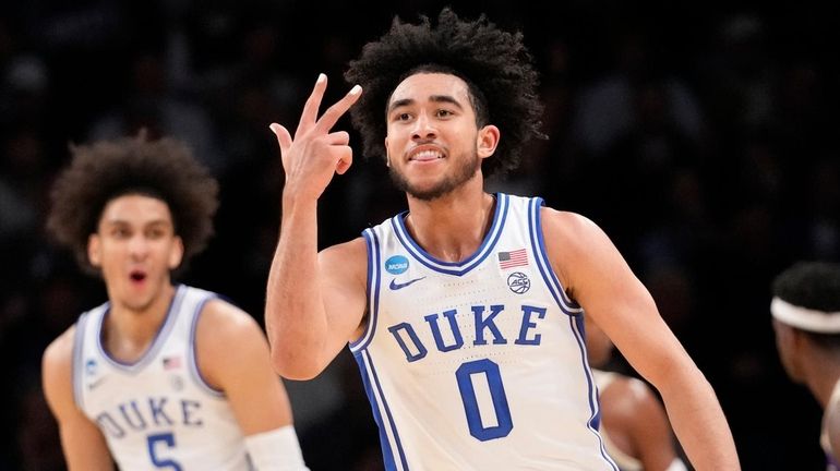 Duke guard Jared McCain (0) and guard Tyrese Proctor (5)...