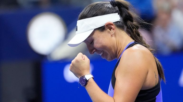 Jessica Pegula, of the United States, reacts after defeating Iga...