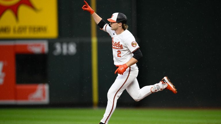 Baltimore Orioles' Gunnar Henderson celebrates his grand slam against the...