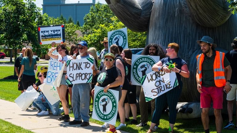 Starbucks employees and their supporters picketed at a Starbucks in Farmingville...