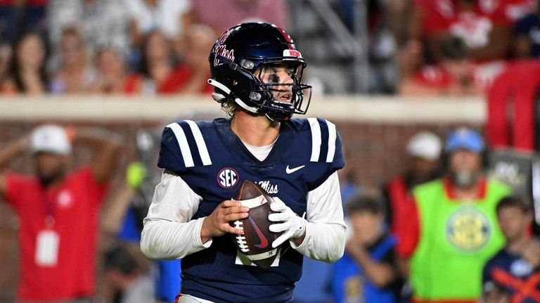 Mississippi quarterback Jaxson Dart looks to pass during the second...