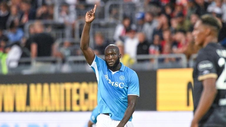 Napoli's Romelu Lukaku celebrates after scoring his side's third goal...