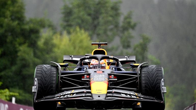 Red Bull driver Max Verstappen of the Netherlands steers his...