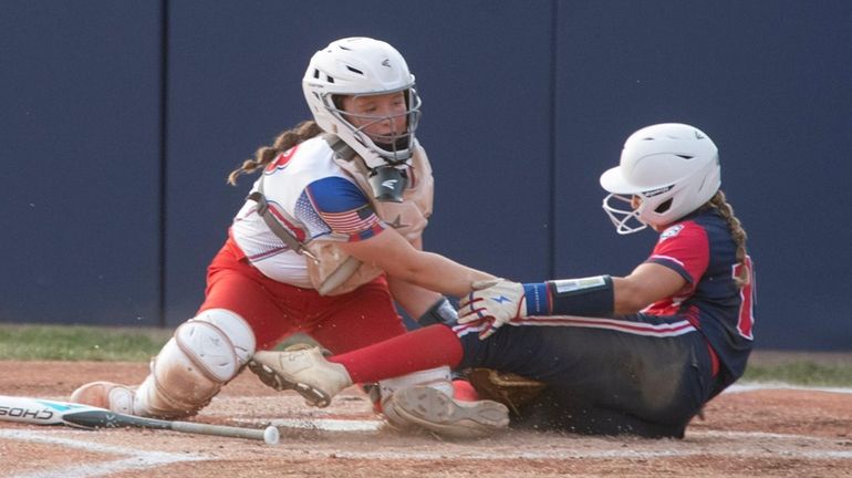 Olivia Feldman of Massapequa International is called out at home...