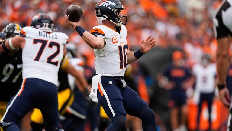 Denver Broncos quarterback Bo Nix (10) throws during the second...