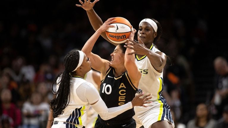 Las Vegas Aces guard Kelsey Plum (10) is pressured by...