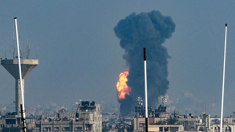 Smoke rises during an Israeli strike on Rafah in the...