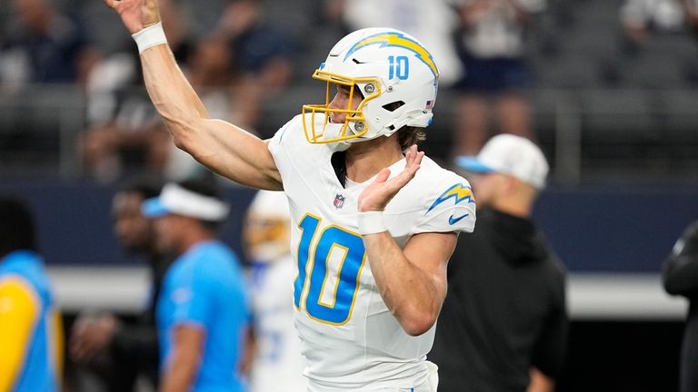 Los Angeles Chargers quarterback Justin Herbert warms up before a...