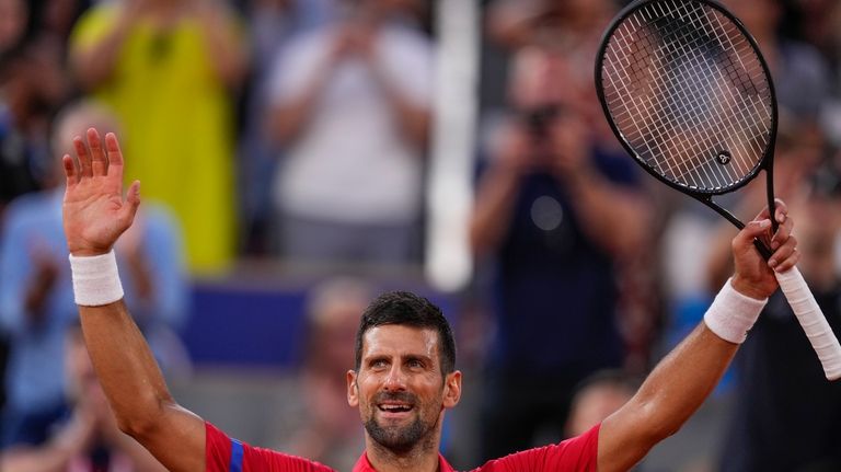 Serbia's Novak Djokovic celebrates his victory over Stefanos Tsitsipas of...