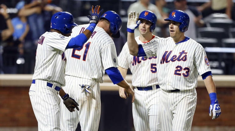 Taylor Teagarden of the Mets celebrates his sixth-inning grand slam...