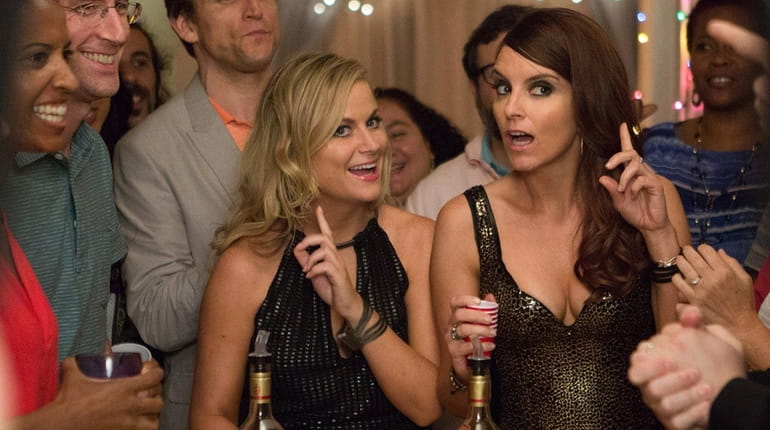 Amy Poehler, left, and Tiny Fey are party siblings in...