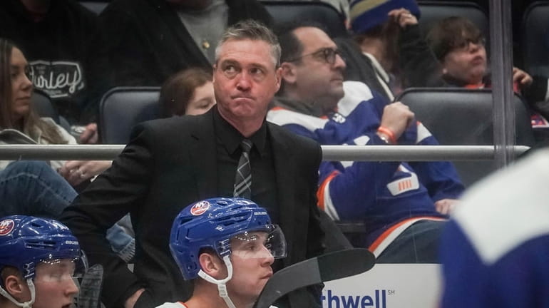 Islanders head coach Patrick Roy, center, reacts, during third period of...
