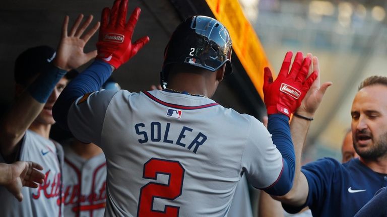 Atlanta Braves' Jorge Soler celebrates his solo home run against...