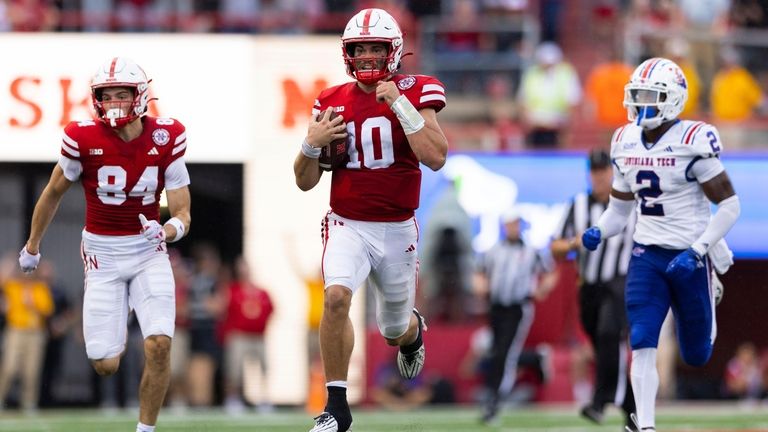 Nebraska quarterback Heinrich Haarberg (10) rushes for 72 yards to...