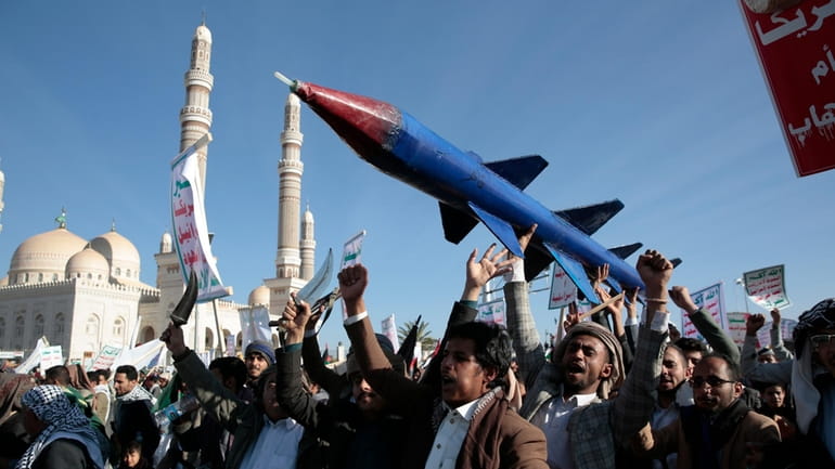 Houthi supporters attend a rally in support of the Palestinians...