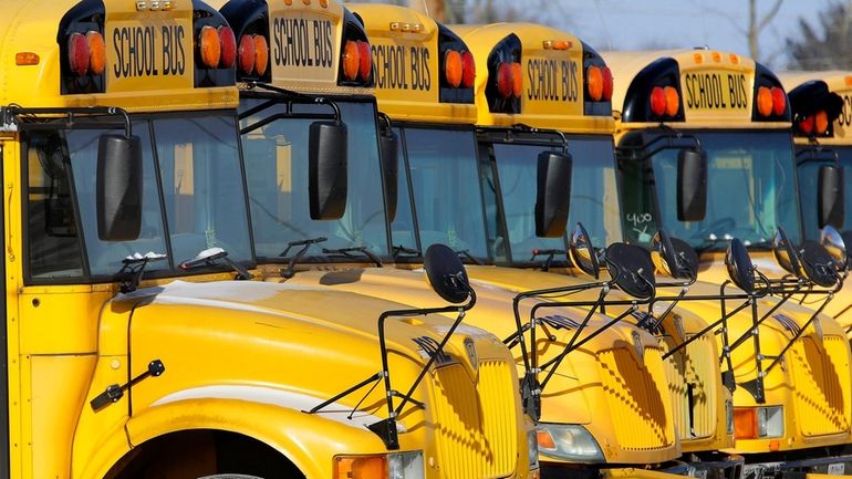 Public school buses are parked in Springfield, Ill., on Jan....