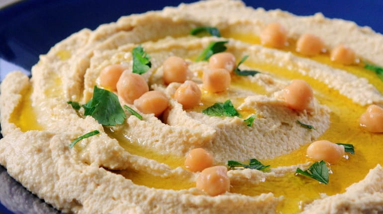 Hummus features ground chickpeas, tahini and lemon juice.